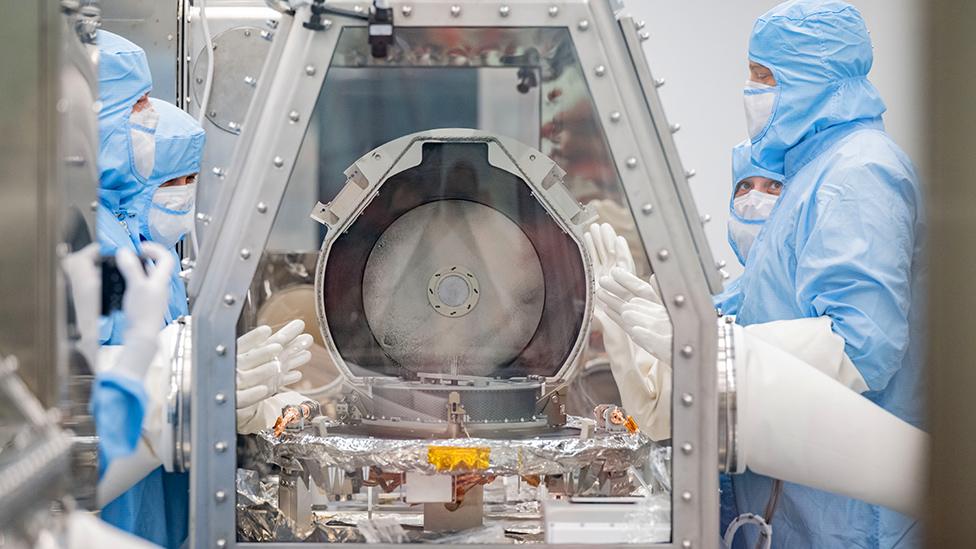 Bennu samples being extracted from Osiris-Rex cannister