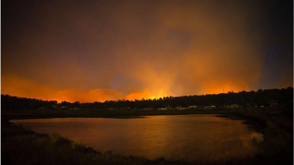 Fires burning dangerously close can be seen from the Central Highlands Lodge from on January 22, 2019 in Miena, Australia