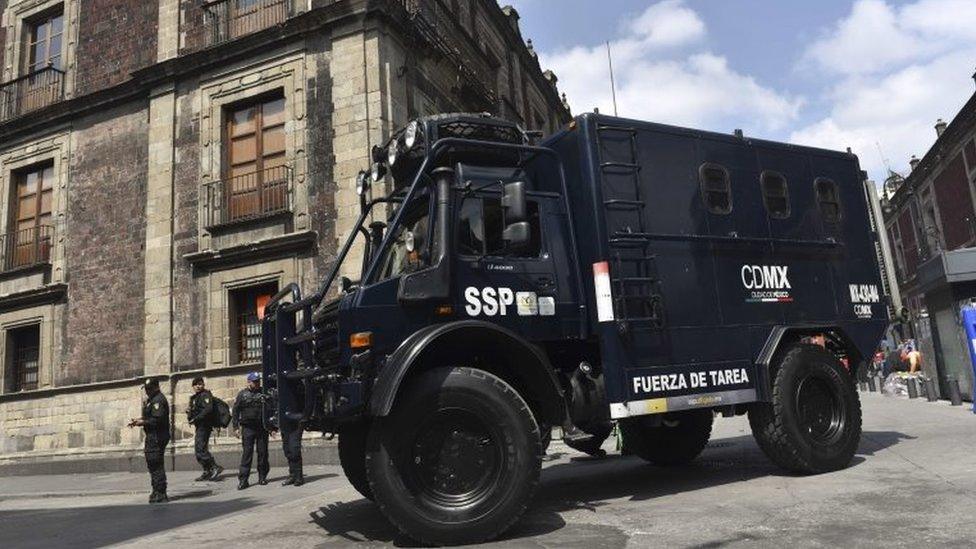 A truck of the Mexican secretary of public security patrols around the perimeter closed to the traffic during the filming of scenes of the movie "Godzilla, King of the Monsters" in the historical centre of Mexico City on August 20, 2017