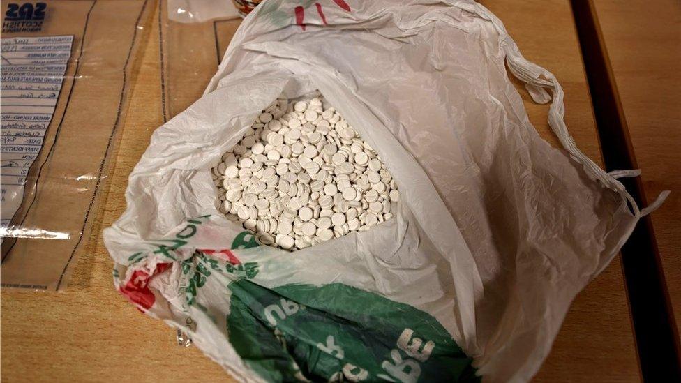 Plastic shopping bag full of tablets