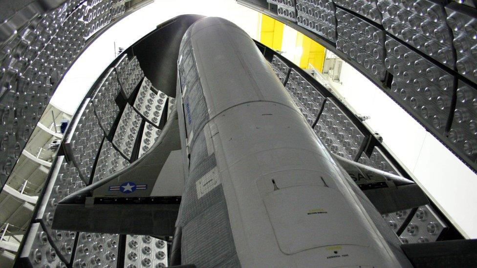 The view inside the rocket, containing the secretive space plane... the rocket launches the plane into the atmosphere until it reaches orbit. It then releases it into space where it communicates with the United States military back on Earth.