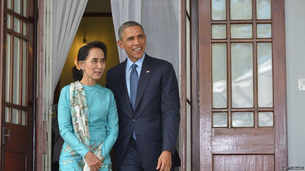 US President Barack Obama and Myanmar's Aung San Suu Kyi speak during a press conference at her residence in Yangon on November 14, 2014