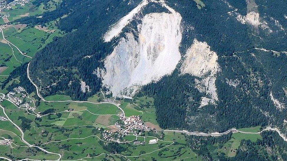 This aerial view of Brienz by Christoph Nänni shows the village of Brienz directly beneath the mass of rock