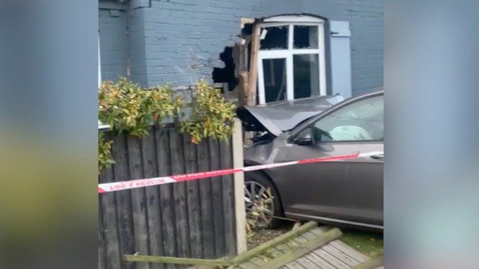 Car crashed into house