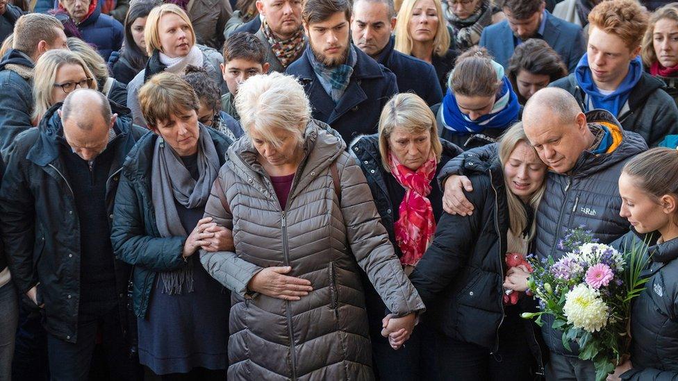 The family of Jack Merritt take part in a vigil at the Guildhall in Cambridge