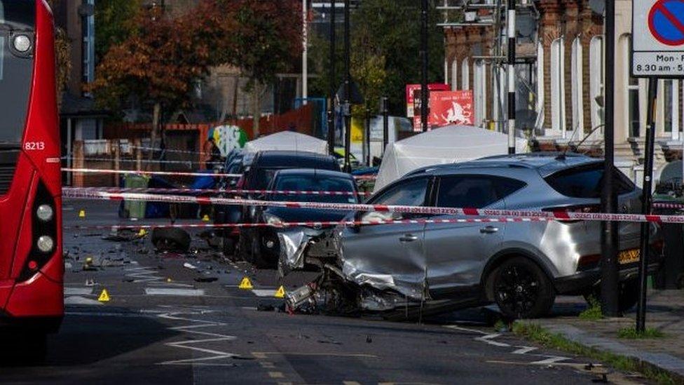 Scene of the incident showing bus and destroyed car