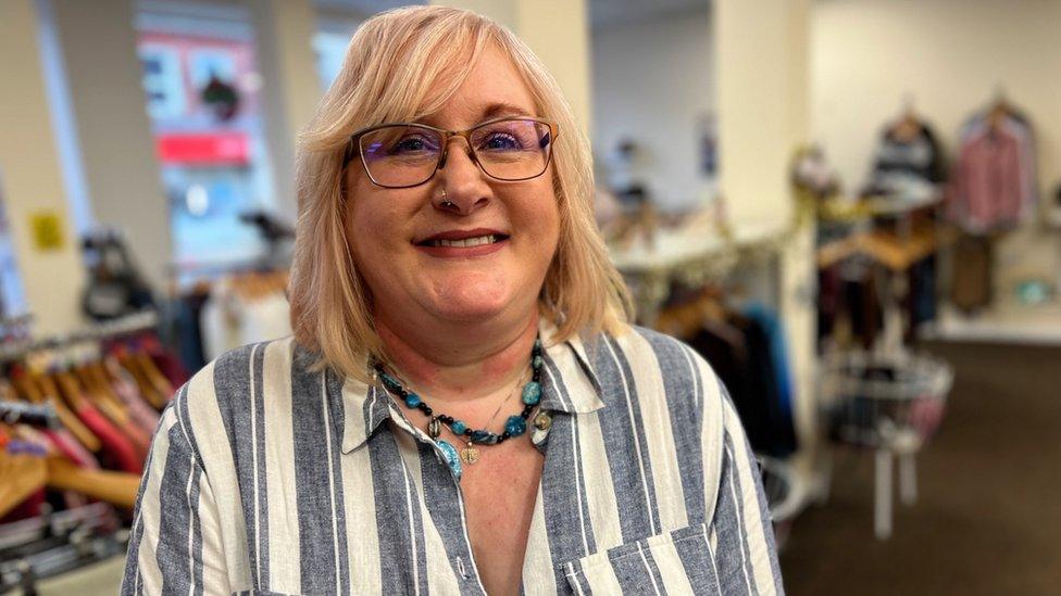 Susan Bidmead from Harwich, standing in a Clacton charity shop.