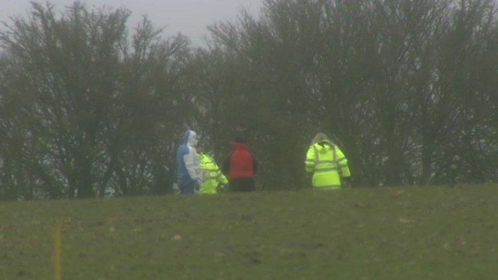 Investigators at air crash scene