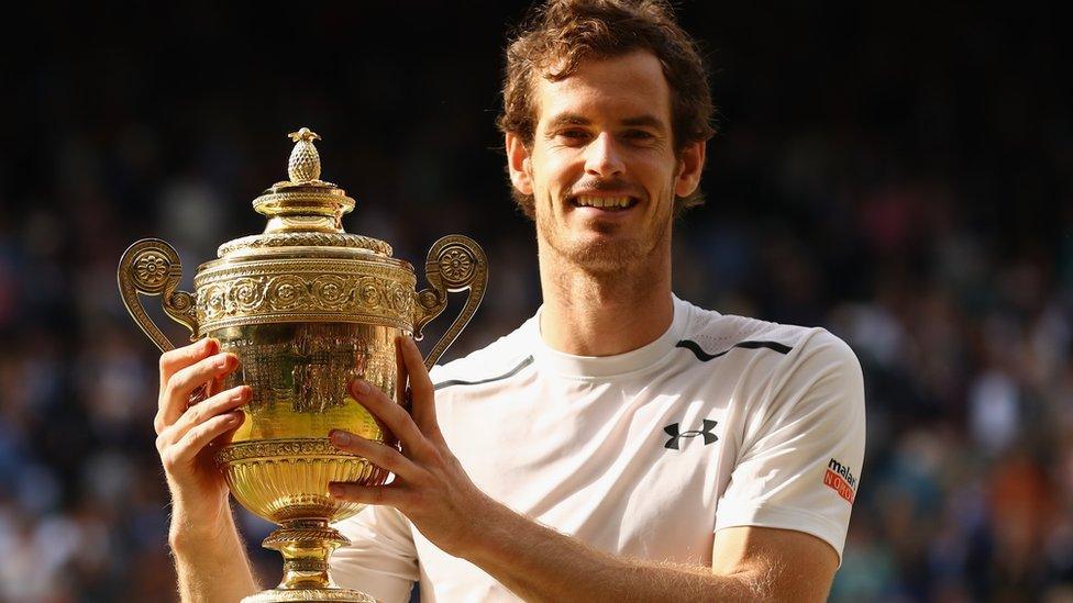 Murray holding the Wimbledon trophy