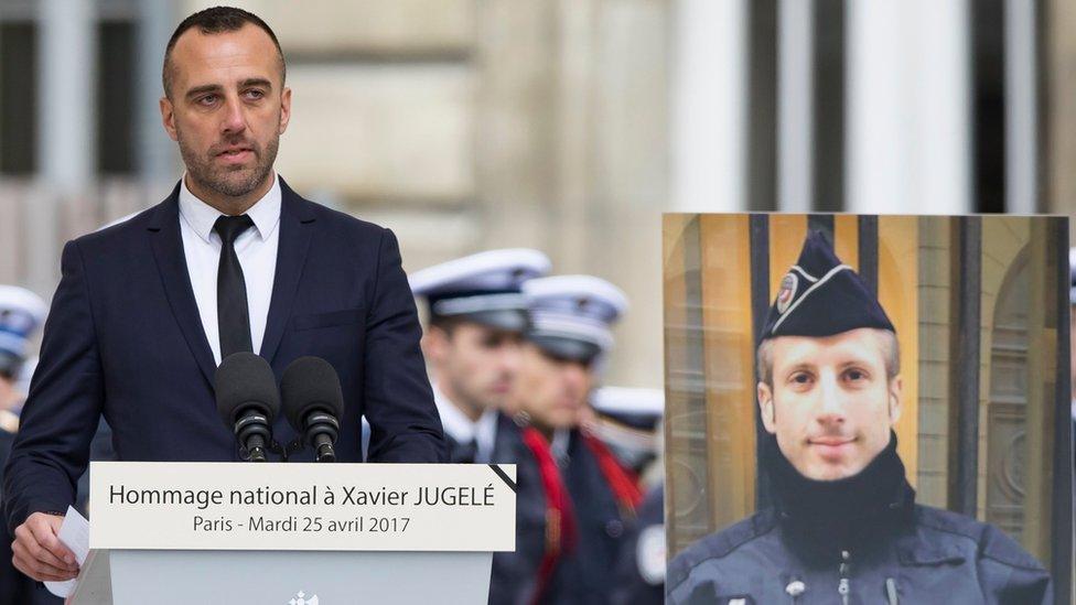 Mr Jugele's partner, Etienne Cardiles, pays tribute at the Paris police headquarters in Paris, France, 25 April 2017