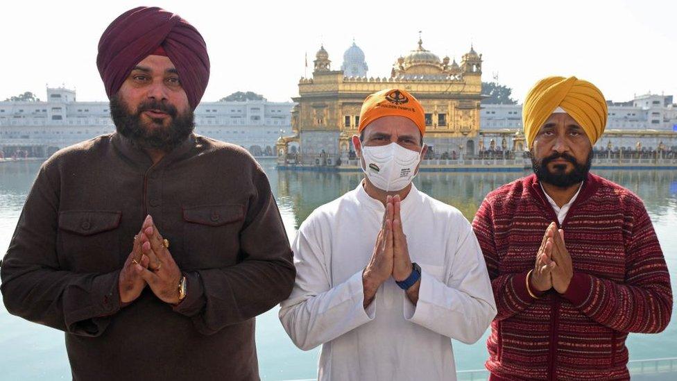 India's opposition Congress party leaders Rahul Gandhi (C), Navjot Singh Sidhu (L) and Punjab's state chief minister Charanjit Singh Channi gesture during their visit at the Golden Temple ahead of state assembly elections in Amritsar January 27, 2022.