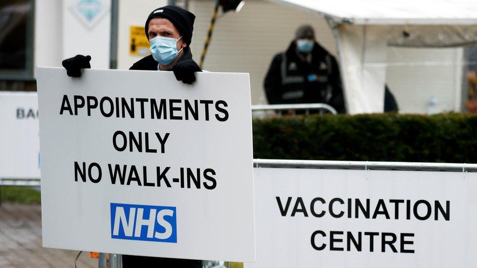 Man holding sign outside cathedral hub