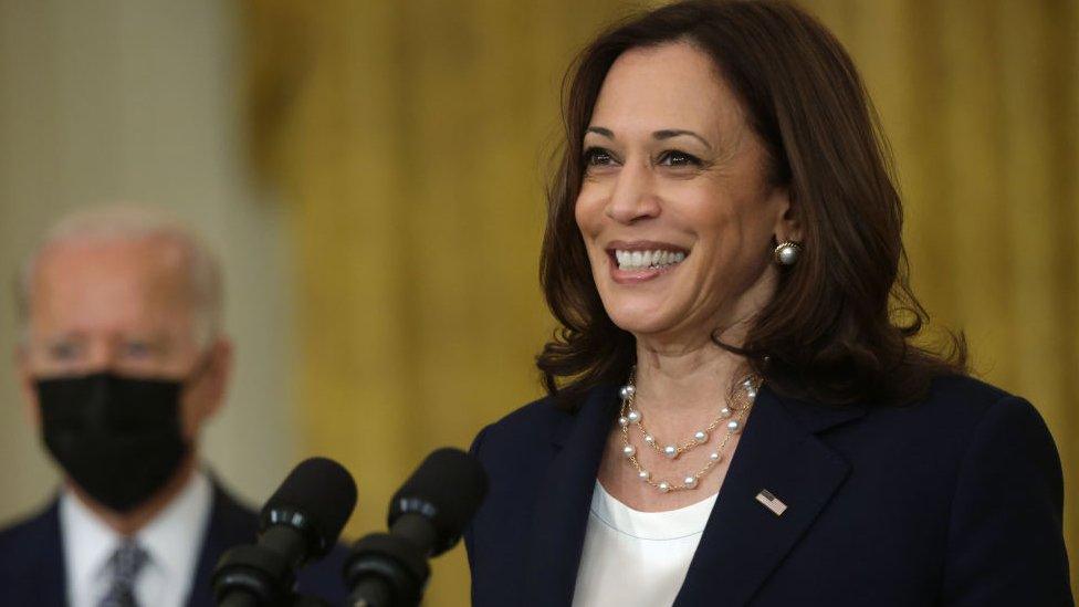 U.S. Vice President Kamala Harris (R) speaks as President Joe Biden (L) listens during an event on Senate passage of the Infrastructure Investment and Jobs Act in the East Room of the White House 10 August 2021 in Washington, DC.