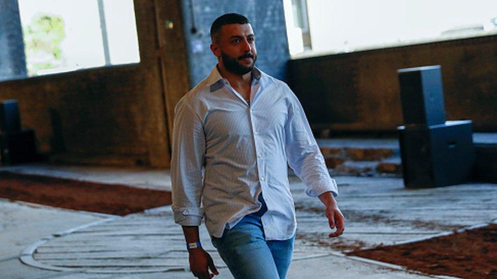 Khalid bin Sultan Al Qasimi walks the runway at the Qasimi show during London Fashion Week