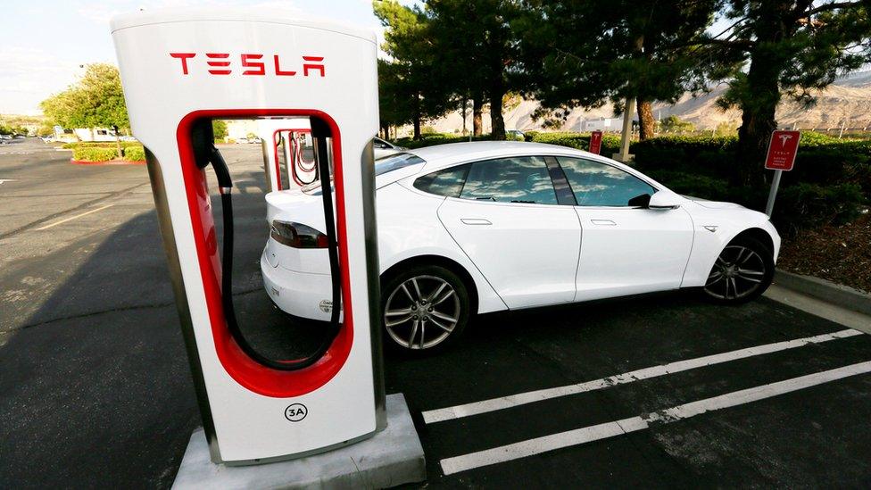 Tesla car at Tesla supercharger station