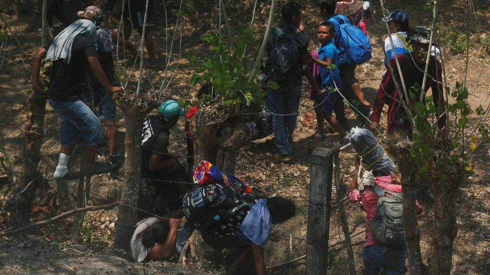 Central American migrants try to flee during an immigration raid on their journey towards the United States