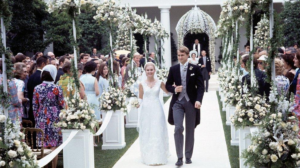 Edward Finch Cox escorts his bride, Tricia Nixon, down the aisle following their wedding in the White House Rose Garden