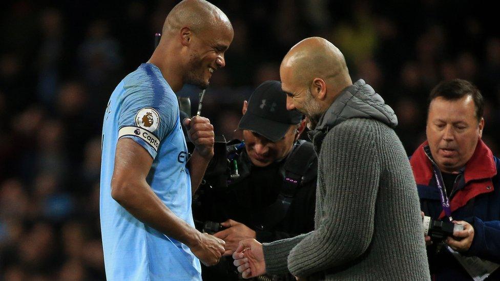 Vincent-Kompany-and-Pep_Guardiola-celebrate-beating-Leicester-City.