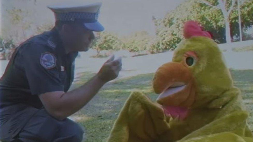 Police officer and chicken