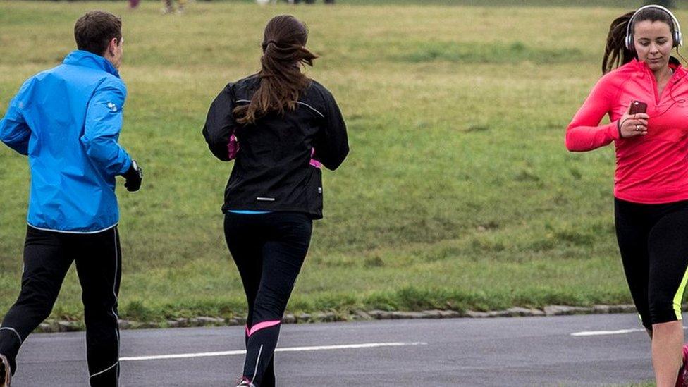 Runners in a park