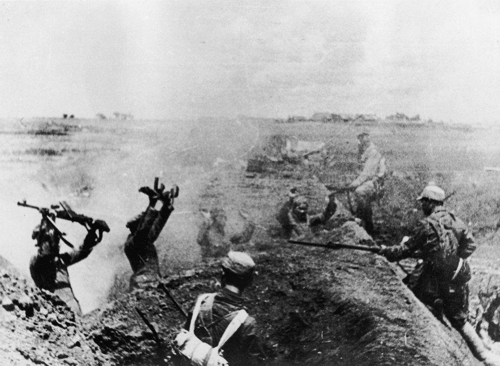 Chinese Communist troops take prisoners at bayonet point after heavy fighting in the attack on Shanghai, China on 21st May, 1949.