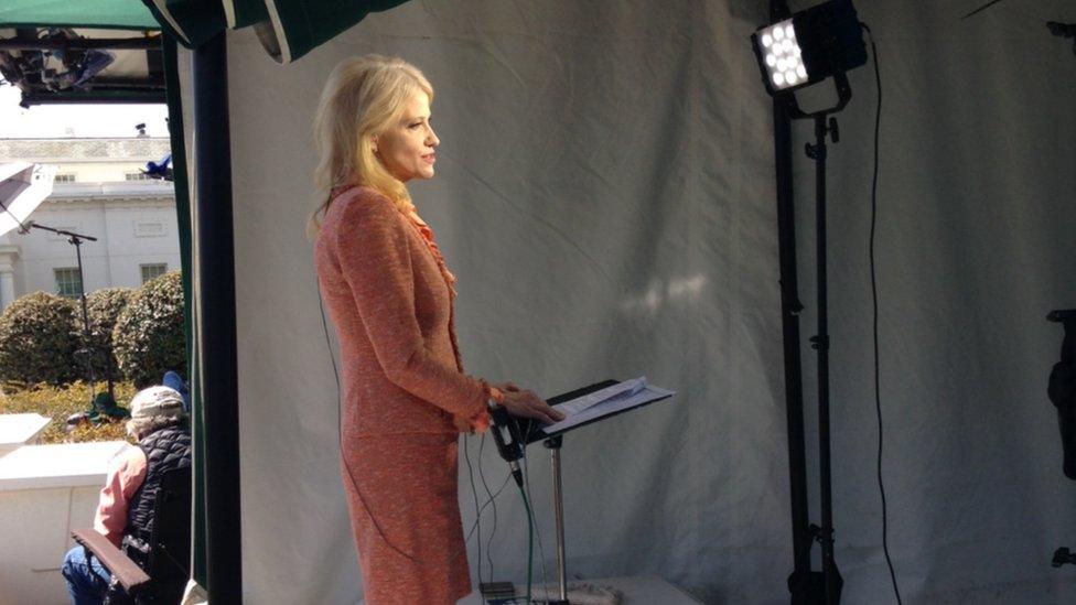 While doing a live shot at the White House, Conway stayed cool despite chaos around her