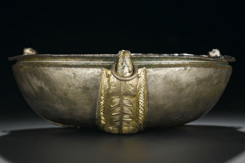 Hanging bowl of silver with three oblong gilt escutcheons in the form of spread-eagled boars Pictish from St Ninian's Isle 8th century.jpg