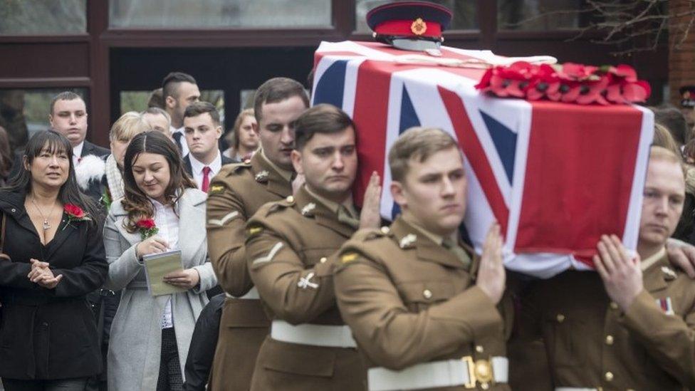 The coffin for Lance Corporal Scott Hetherington is carried from All Saints and Martyrs Church in Middleton, Greater Manchester following a Military funeral