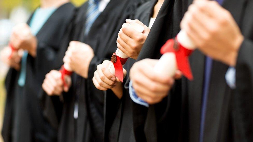 Graduates holding degree certificates