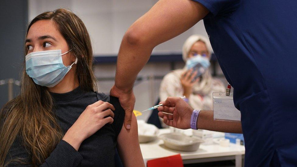 A teenager is vaccinated