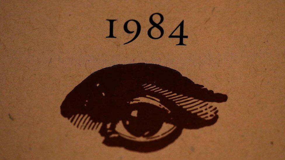 A copy of George Orwell's novel 1984 sits on a shelf at The Last Bookstore on January 25, 2017