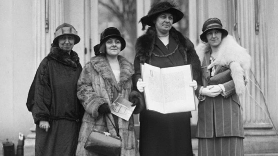 black and white photo of women in 1924 holding a petition