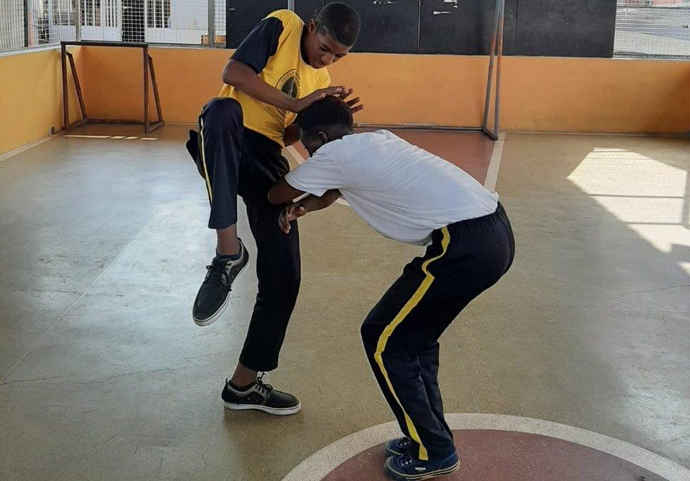 People practicing Capoeira Angola