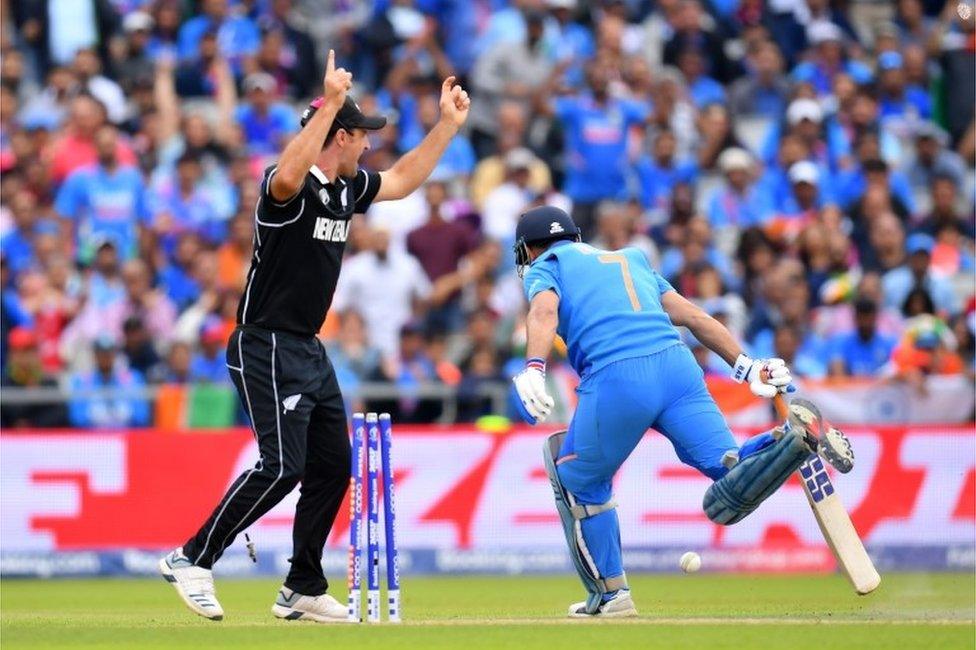 MS Dhoni of India is run out by Martin Guptill of New Zealand during resumption of the Semi-Final match of the ICC Cricket World Cup 2019 between India and New Zealand after weather affected play at Old Trafford on July 10