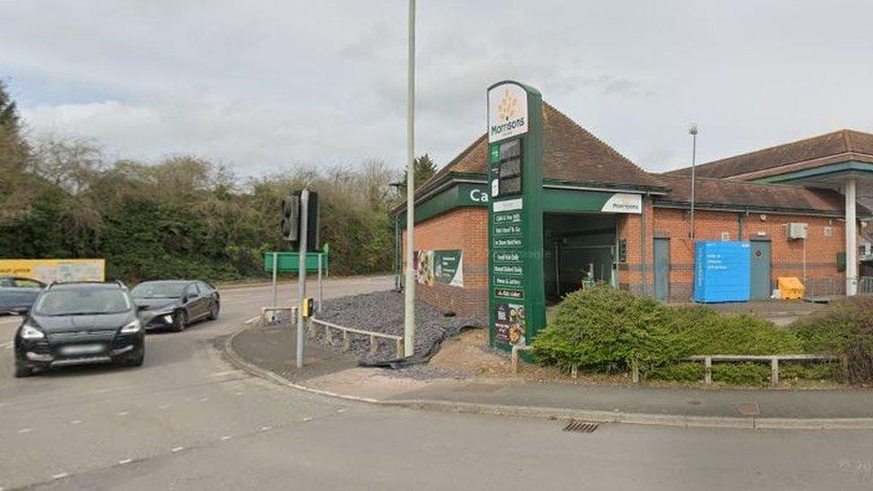 A Morrisons petrol station and a pedestrian crossing