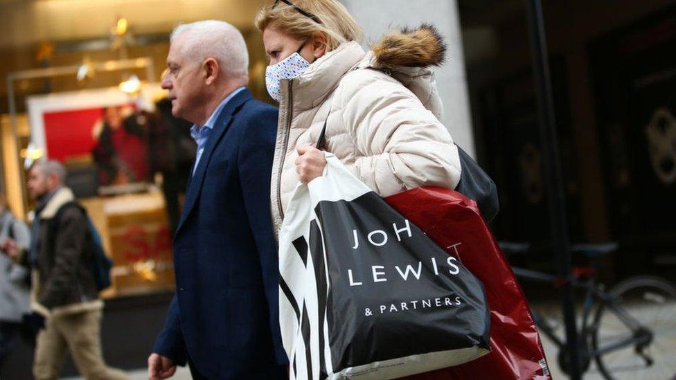 Woman carrying John Lewis bag