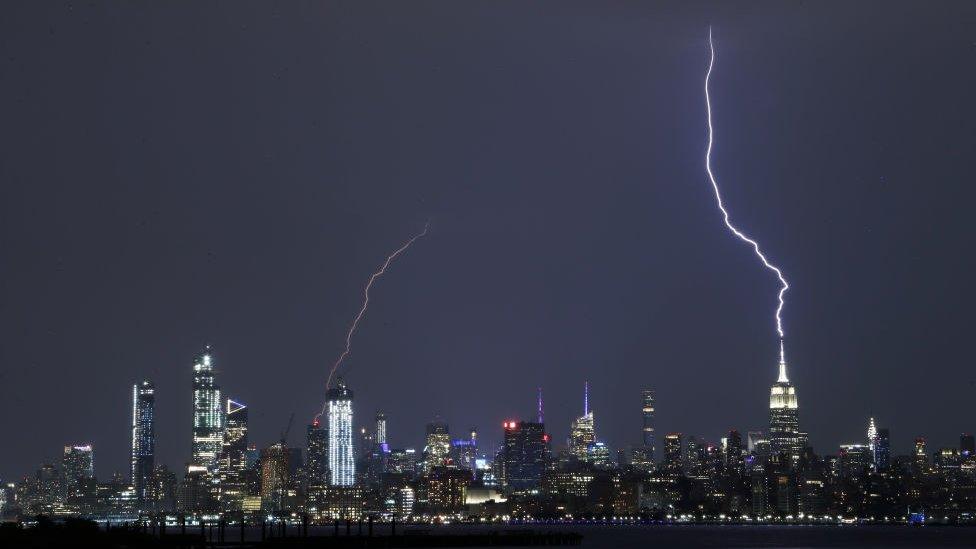 Empire state building being struck by lightning