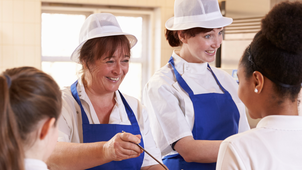 Pupils being served a school meal