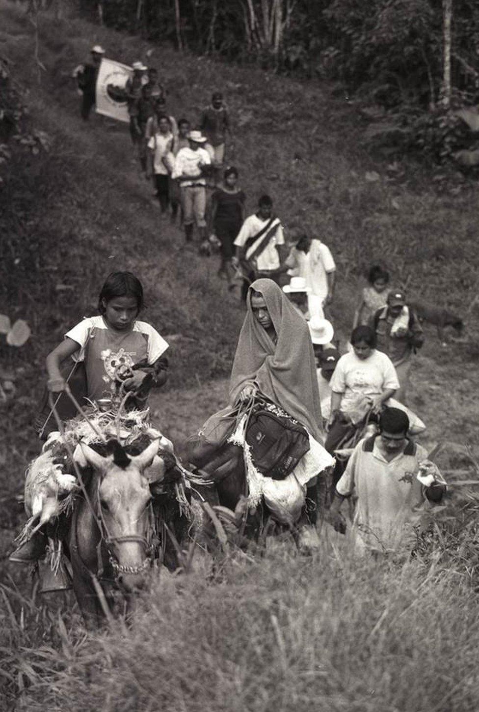 Peasants leaving their village of San Josde Apartad following a massacre by paramilitaries