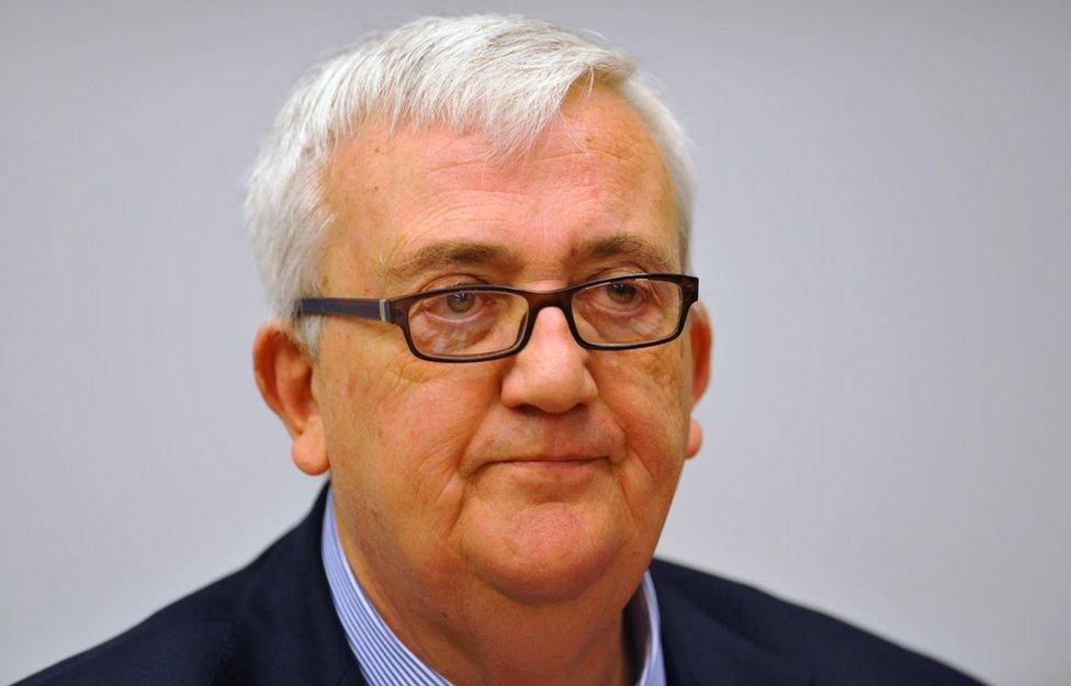 MEP from Italy's anti-immigration Northern League party Mario Borghezio listens next to French far-right leader of the Front national (FN) Marine Le Pen (not pictured) during a press conference on March 15, 201