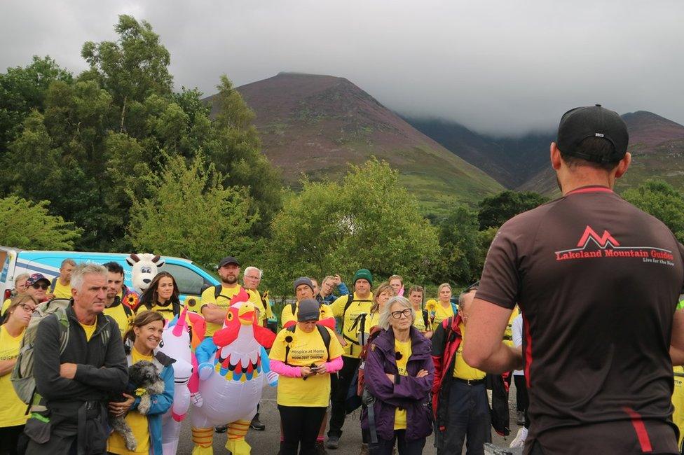 A guide gives a safety briefing before the walk