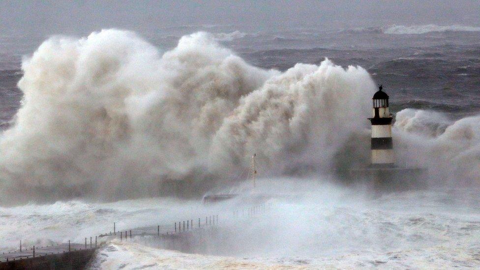 Huge waves crash against the pier wall at Seaham Lighthouse during Storm Arwen, in Seaham, County Durham on 27 November