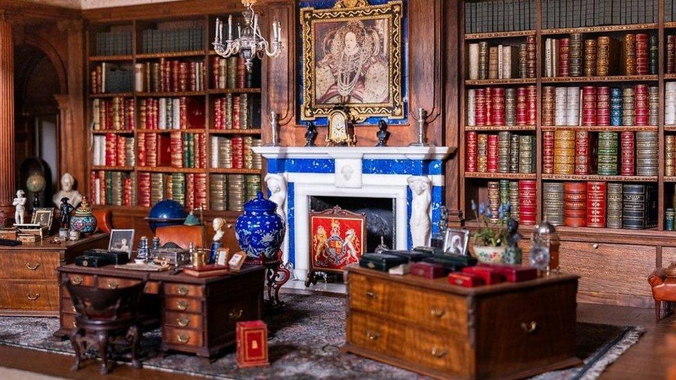 A collection of tiny treasures from Queen Mary's Dolls' House has been put on show to mark the 100th anniversary of its creation.