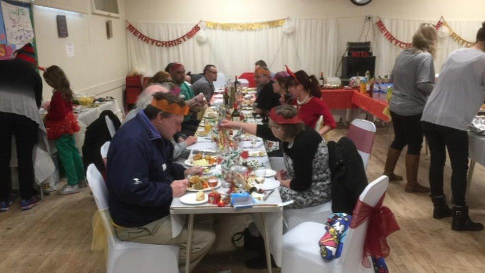 People enjoying Christmas dinner hosted by Mo Fayose