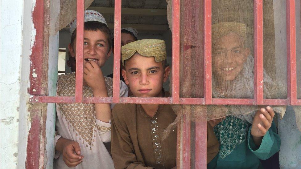 Children seen through the window in Musa Qala