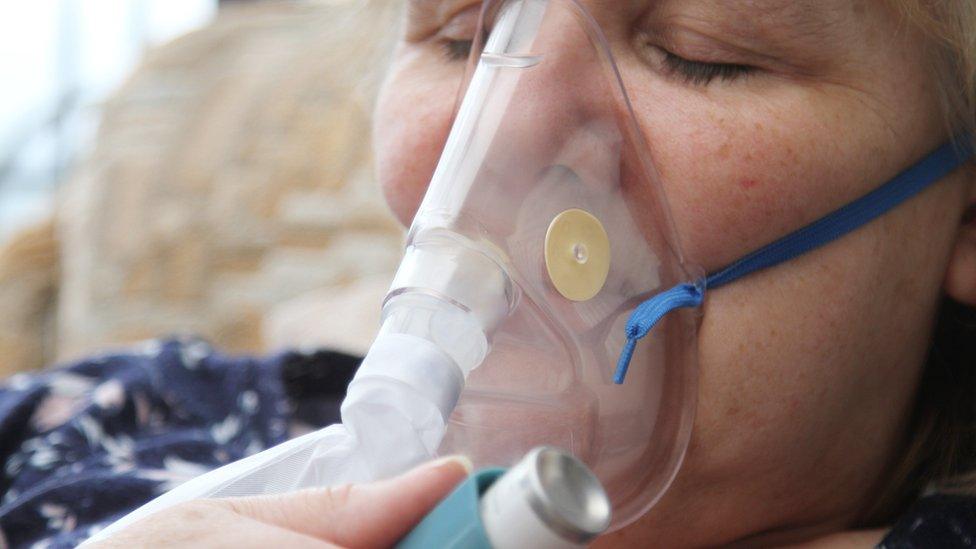 Woman with oxygen mask