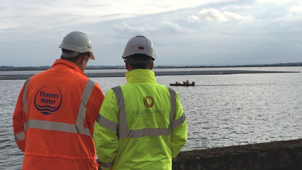 Conor McGuigan of Lightsource and Angus Berry of Thames water looking at solar farm