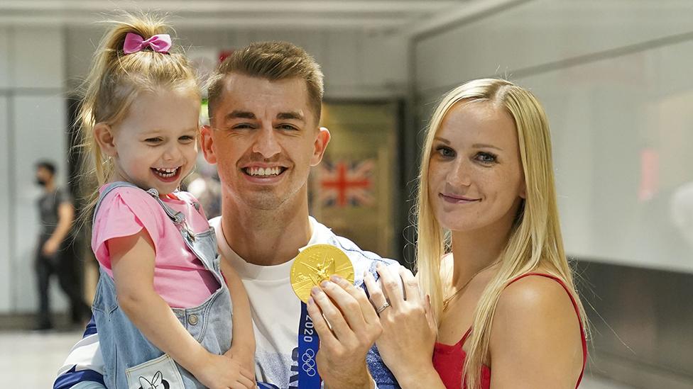 Max Whitlock with his wife and daughter at London Heathrow