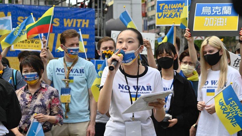 Taiwanese march on the streets protesting the war in Ukraine during a rally in Taipei on March 13, 2022.