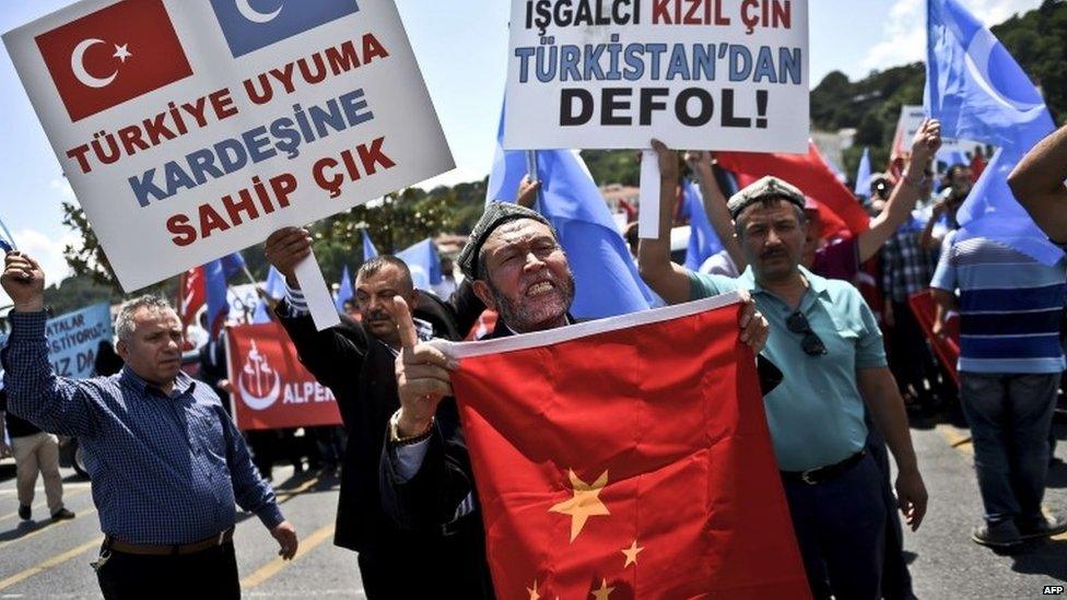 Turkish nationalists holds placards reading 'Turkey save your Brother-China get out from east Turkestan'